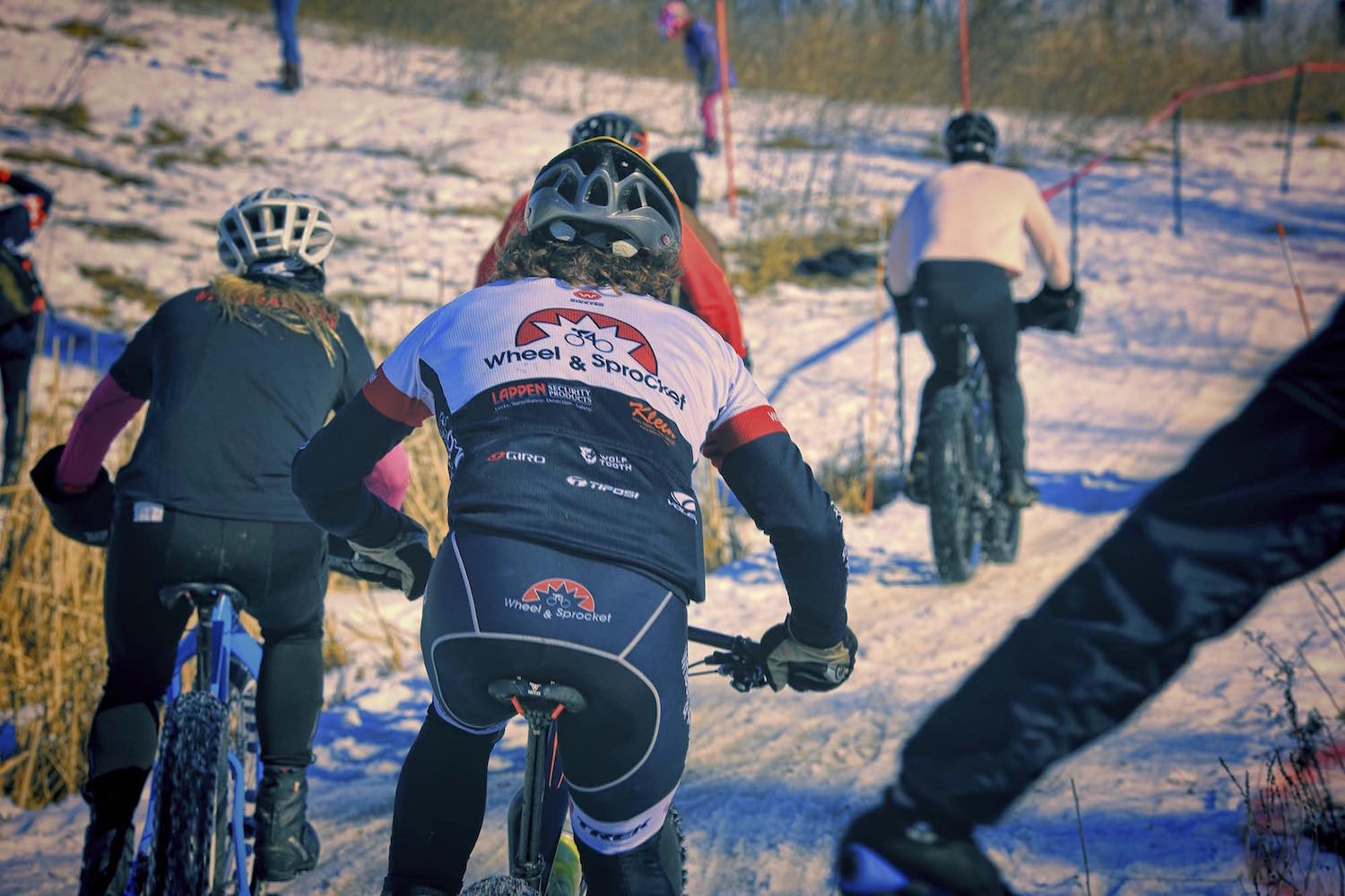 The fat bike peloton thunders down a straightaway at Lecker Park in Appleton, Wisconsin.